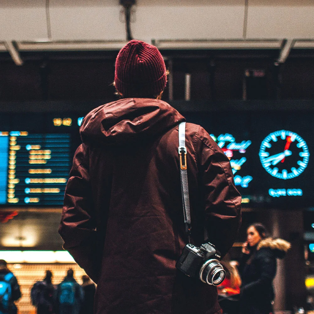 Man on Airport Watching Board